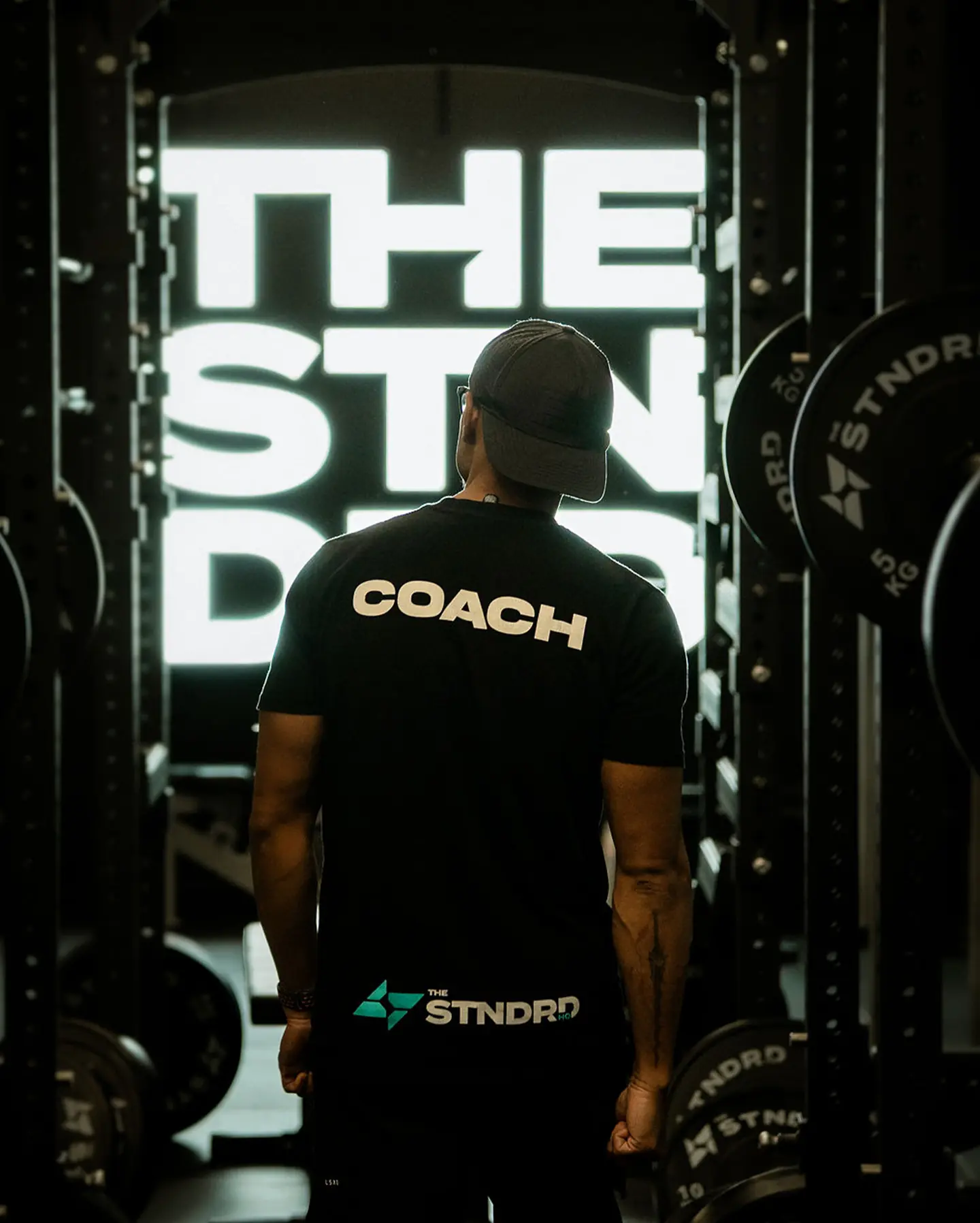 A coach on the strength floor