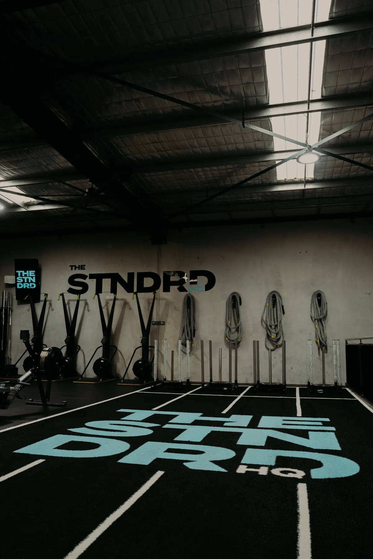 Sled lanes on turf with the STNDRD logo