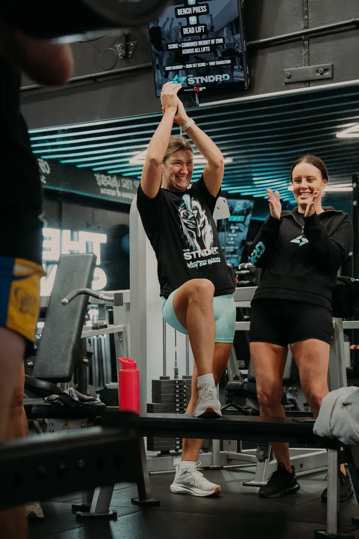 Teammates cheering a box step-up