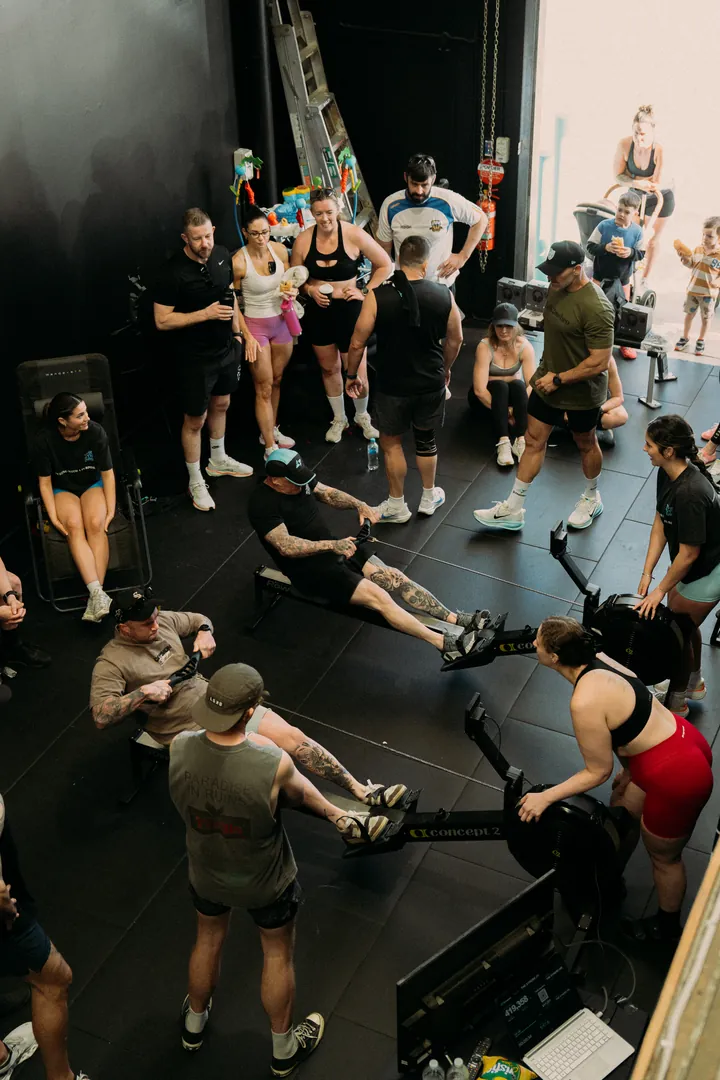 The studio packed with members rowing and cheering
