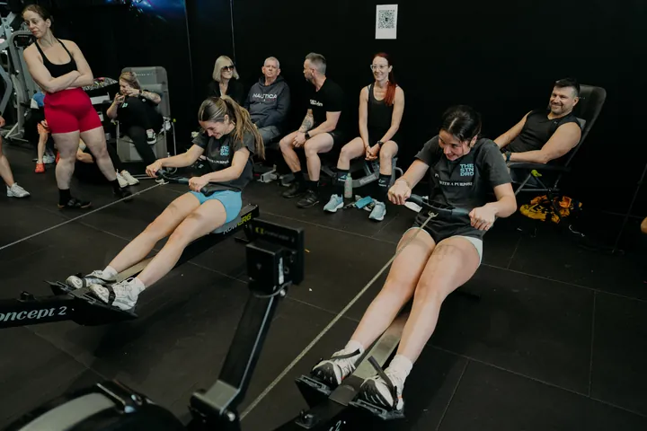 Members rowing side by side